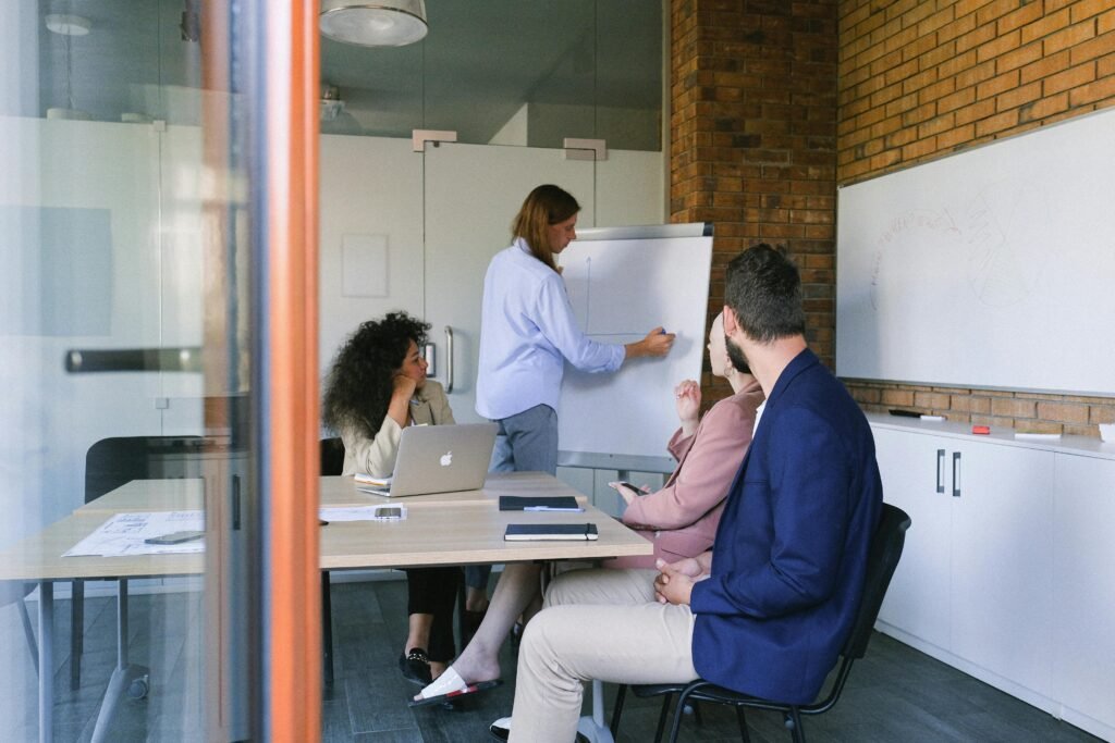 Group of coworkers brainstorming in modern workspace